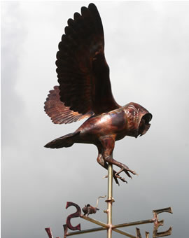 A hunting barn owl weathervane