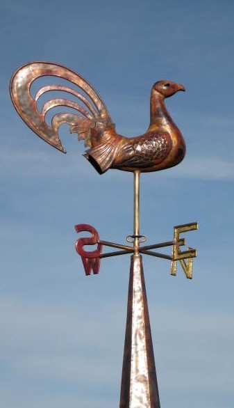 English weathercock on copper spire